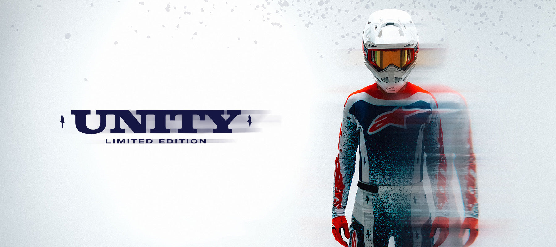 Alpinestars Limited Edition Techstar Unity Gear Set, red, white, and blue motocross racing outfit with white helmet.