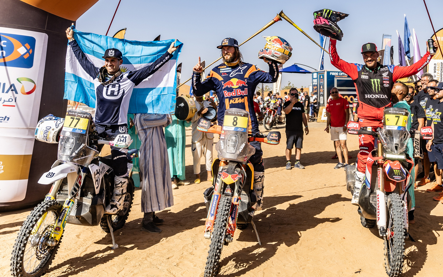 Pablo Quintanilla and other rally athletes celebrating at the finish of a race