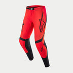 Alpinestars Supertech Ember LE bukser, motocrossbukser, Red Fluo og Bright Red med sorte detaljer, store Alpinestars-logoer på lårene, perforerede zoner til ventilation, sorte paneler på indersiden af benene og skinnebenene, højtydende udstyr til terrænkørsel.