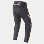 Alpinestars 2021 Techstar Phantom bukser, motocrossbukser, sort og hvid, set bagfra med hvidt ASTARS-branding på linningen og siden af låret, koksgrå teksturerede mesh-paneler på benene, præstationsorienteret race-fit design.