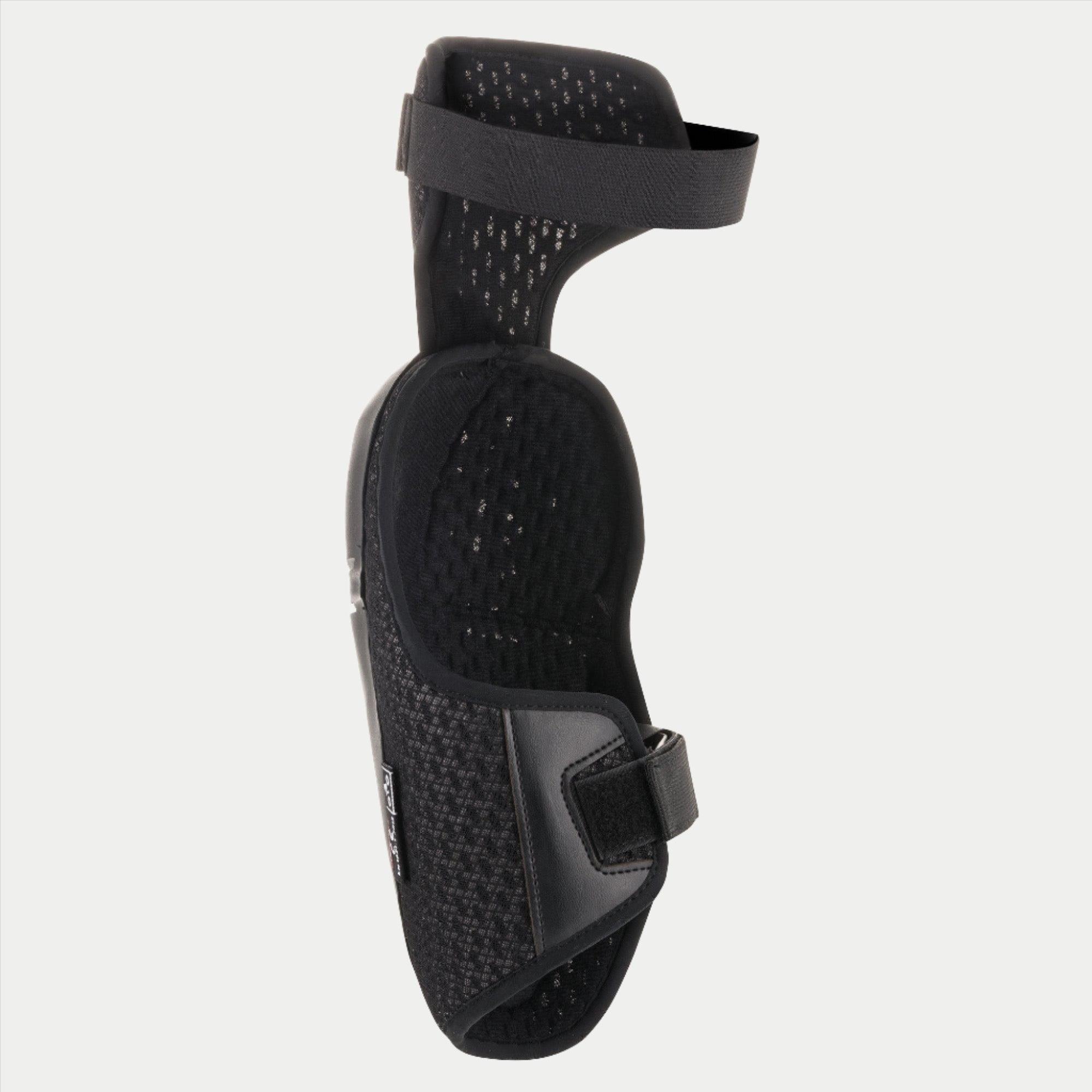 Alpinestars Youth Bionic Plus knæbeskytter, sort, viser den indvendige mesh-foring og det dobbelte stropsystem, ergonomisk design til off-road motocross-beskyttelse